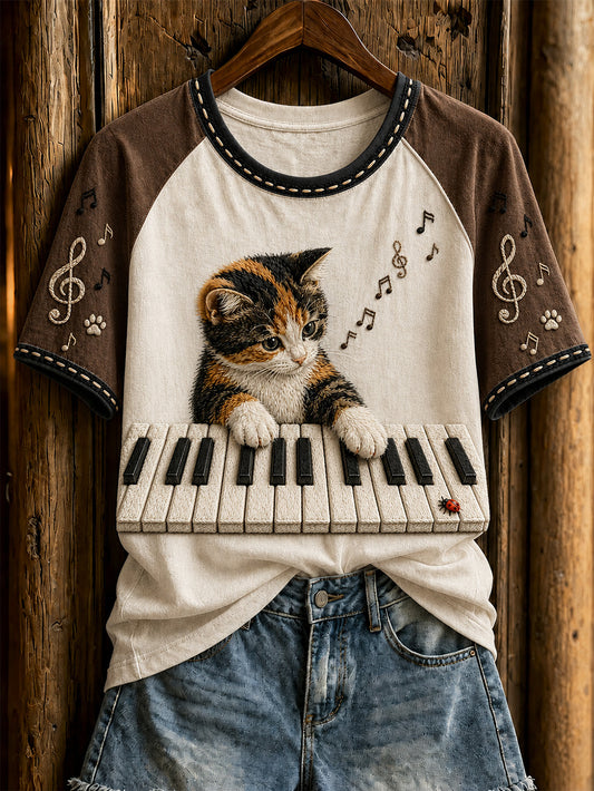 Camiseta casual de manga corta con diseño de lindo gato y piano para mujer